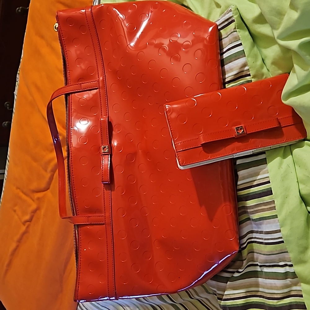 Red Kate Spade handbag and wallet.